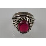 A silver and red cabouchon stone gentleman's ring