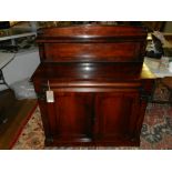A William IV/Victorian rosewood chiffonier, the raised back incorporating a shelf, the base with