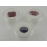 Two red synthetic gemstones, together with a blue synthetic gemstone. (3)