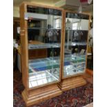 A pair of contemporary elm open bookcases, rectangular with bevelled mirror interior and glass