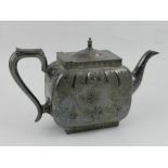 A 19th century style silver plated teapot, engraved with scrolling foliage.