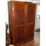 An early 20th century oak cupboard, the pair of panel doors enclosing a shelved interior, H. 184cm.