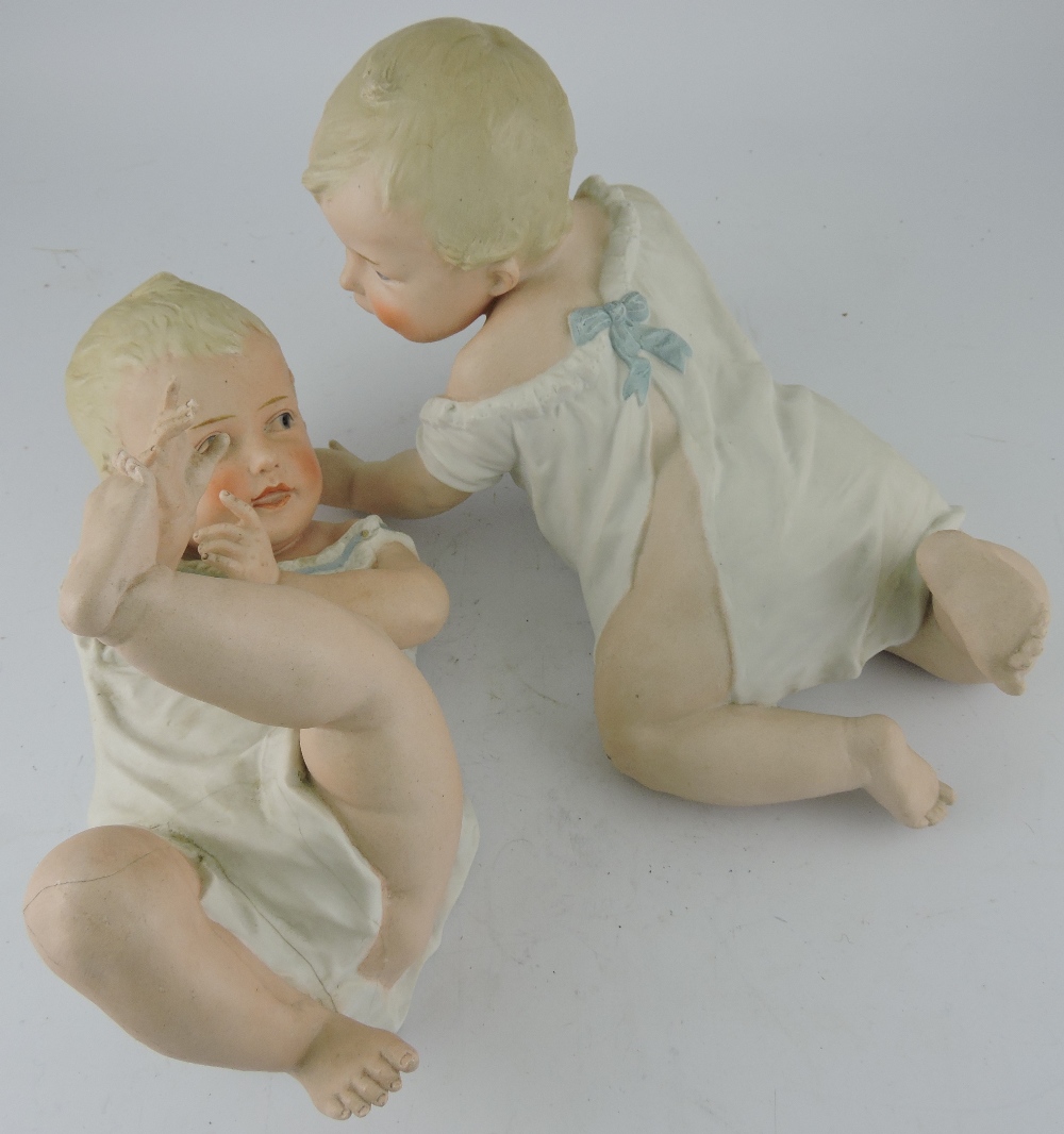 A pair of early 20th Century Continental bisque piano dolls, H.