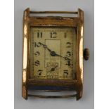 An Art Deco rectangular rolled gold watch head,