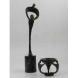 A bronze figural study, 'Mother and Child', raised on a faux marble base, H.