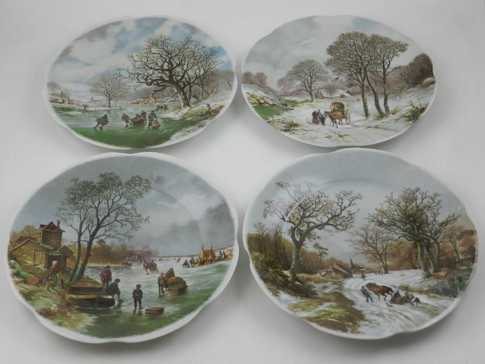 A collection of four Royal Schwabap hand painted plates,