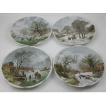A collection of four Royal Schwabap hand painted plates,