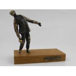 After Harrie Lenferink, a bronze study of a man playing Klootschieten (ball shooting),