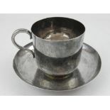 An Oriental silver cup and saucer, c.