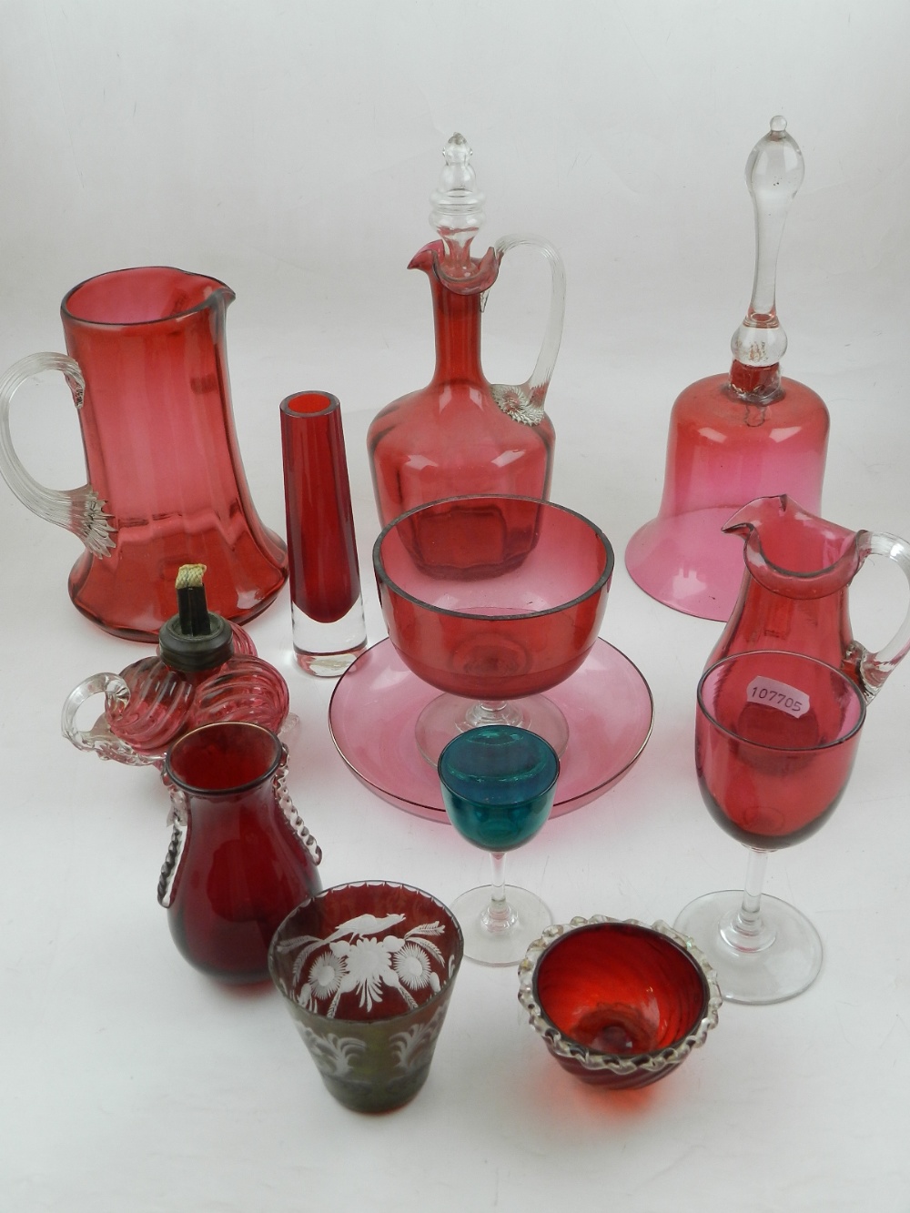 A small quantity of cranberry glassware, to include jugs, a drinking glass, a plate, etc.