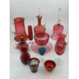 A small quantity of cranberry glassware, to include jugs, a drinking glass, a plate, etc.