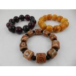 A Chinese amber beaded bracelet, together with a zoisite beaded bracelet,