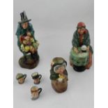 A Royal Doulton fortune teller figurine, together with a Mask Seller figurine,