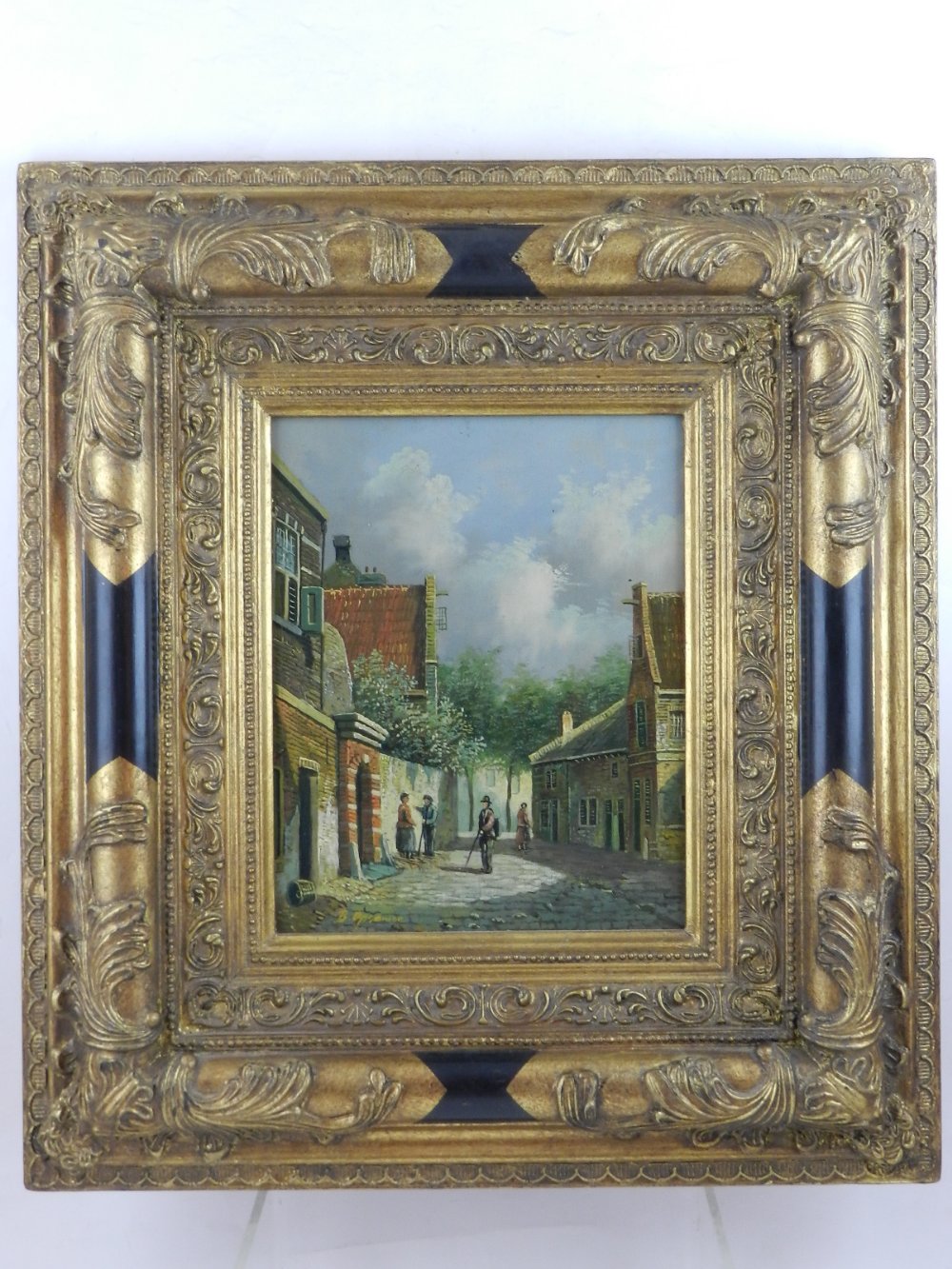 After Cornelis Springer, a view of a cobbled street, oil on panel, signed 'B. Ospamer' lower left.