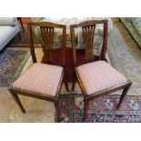 A pair of mahogany side chairs, with splat backs, slip-in seats and tapered square legs, together