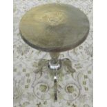 A pair of circular chromed metal tripod wine tables