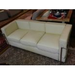 After Le Corbusier chrome and cream leather three seater sofa with loose cushion seat on tubular