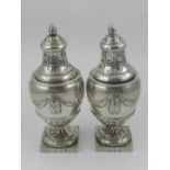 A pair of 19th Century Continental silver sugar casters,