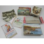 A quantity of early 20th century postcards including three 'naturist' cards together with general