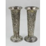A pair of late Victorian silver stem vases, the tapered cylindrical bodies with pierced floral and C