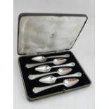 A cased set of six silver grapefruit spoons, by Asprey of London, the terminals embossed with Celtic