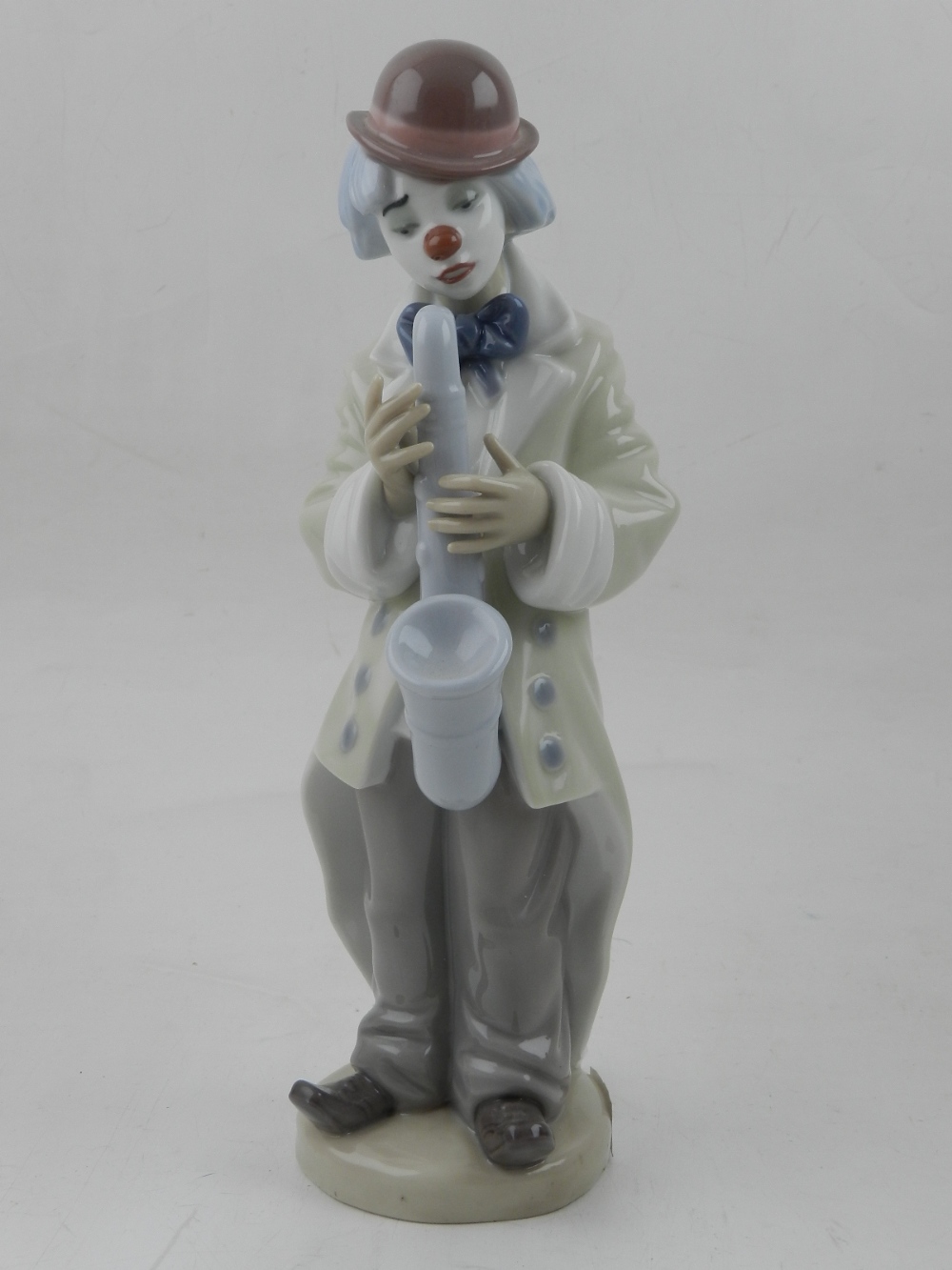 A Lladro porcelain figure of a clown, entitled 'Sad Sax' no.5471 c..