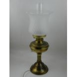 A brass oil lamp, having opaque glass shade. Approx.