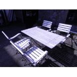 A slatted white painted wood, metal framed rectangular folding garden table and four matching