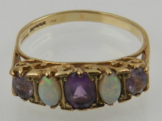 A 9 carat yellow gold, amethyst, and opal five stone ring,