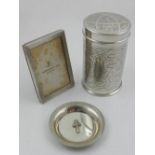 A Persian white metal cylindrical box and cover, together with a white metal silver photograph