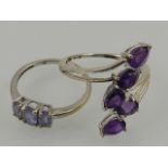 A 9 carat white gold and amethyst crossover ring set five pear-cut stones,