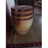 A Doulton treacle salt-glazed ceramic circular garden seat. H: 55cm D: 36cm