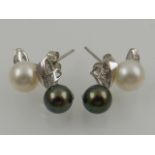 A pair of white gold, diamond, and pearl earrings, stamped 750.