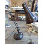 A vintage Herbert Terry brown metal angle poise desk lamp