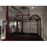 A Victorian mahogany wirework birdcage of pagoda form with raised, domed central section, w:82cm