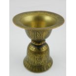 An 19th century Indian brass spit cup.