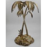 A large white metal centrepiece, modelled as two palm trees, H. 34cm