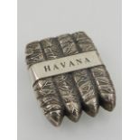 A novelty white metal vesta case in the form of four cigars, the band marked 'Havana'.