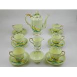 A Crown Staffordshire hand-painted Art Deco tea service, including a teapot, together with a Blyth