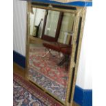 A rectangular wall mirror, with a bevelled plate within an ebonised and gilt frame, H. 120cm.