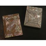 A mother-of-pearl card case of rectangular form, decorated with a silver cartouche, together with