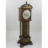 An early 20th mantel timepiece, in the form of a miniature longcase,