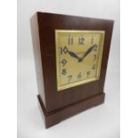An Art Deco walnut mantel clock, by Zenith, the rectangular gilt dial with Arabic numerals, coin