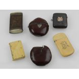 Six assorted vesta cases, two with nut casing bodies, two in ivory, one lether clad and another in