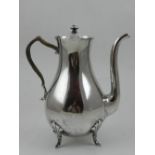 A Sterling silver chocolate pot, with pie crust border,