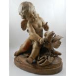 A French terracotta figure of a winged cherub with a quiver of arrows, raised on an oval base. H: