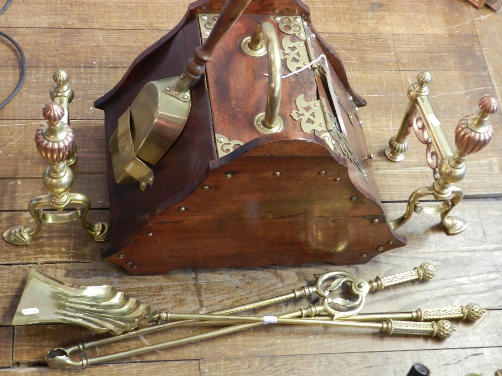 A Victorian walnut coal scuttle with brass mounts,