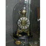 A brass skeleton clock, of architectural form,