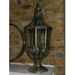 An octagonal gilt metal glazed lantern, the interior hung five tea light holders,