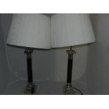 A pair of reproduction Victorian style nickel plated faux marble table lamps with pleated shades H